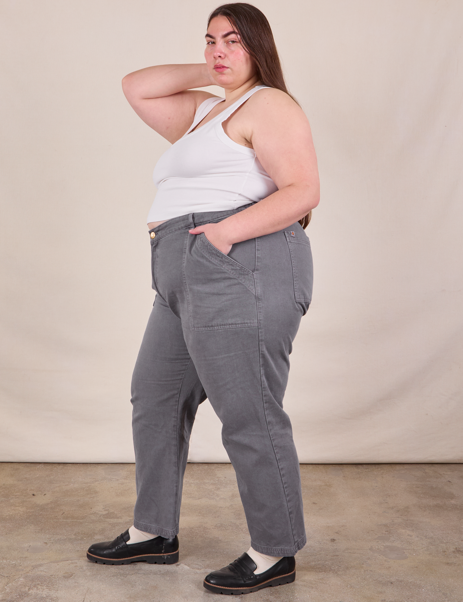 Side view of Work Pants in Washed Grey and Cropped Tank in Vintage Tee Off-White on Marielena