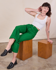 Alex is wearing Western Pants in Forest Green and Cropped Tank in Vintage Tee Off-White