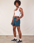 Angled front view of Western Shorts in Lagoon and Cropped Tank in vintage tee off-white on Jerrod