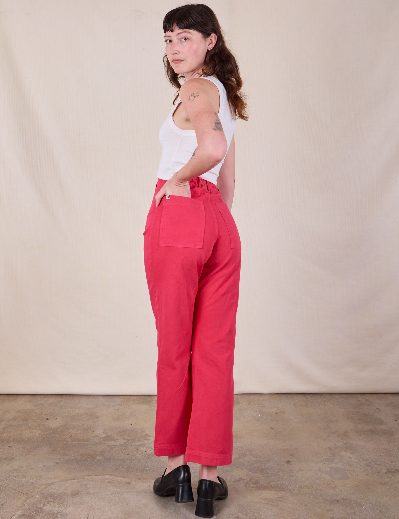 Angled back view of Western Pants in Hot Pink on Alex