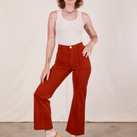 Alex is 5'8" and wearing XS Western Pants in Paprika and vintage off-white Tank Top