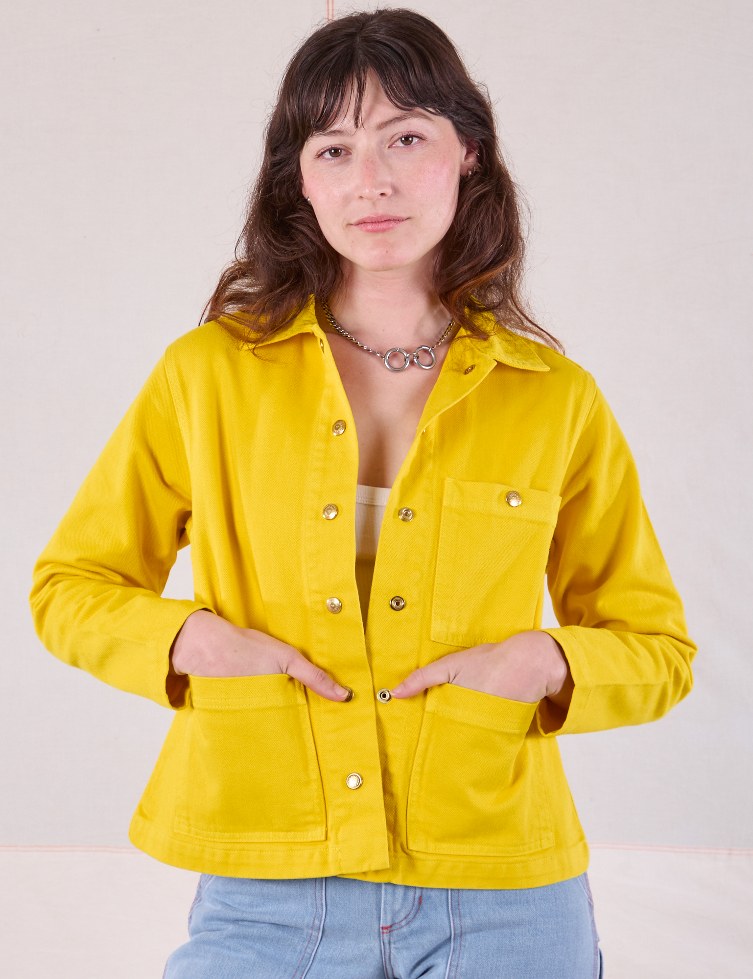 Alex is 5&#39;8&quot; and wearing P Denim Work Jacket in Golden Yellow