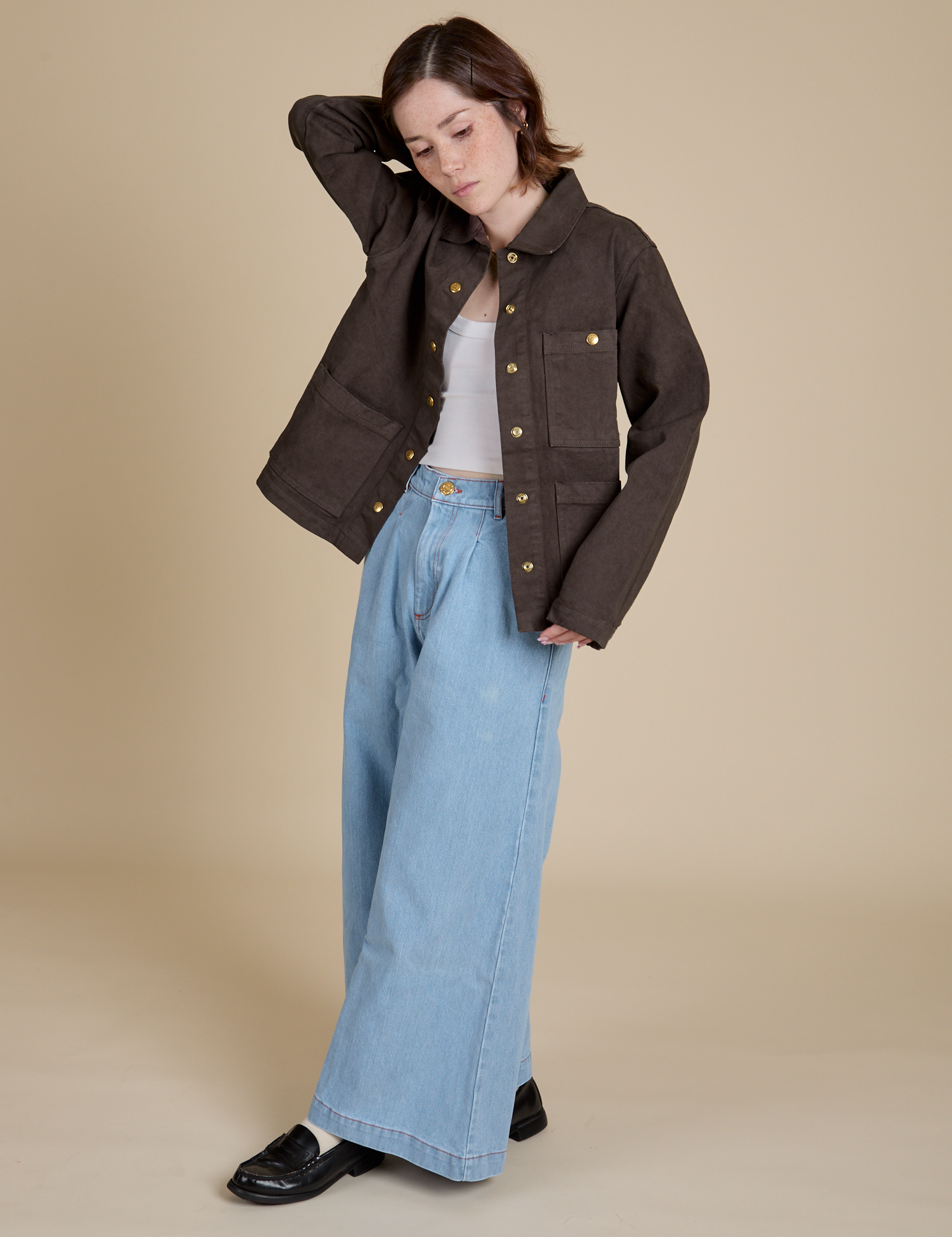 Hana is wearing Denim Work Jacket in Espresso Brown and light wash Indigo Wide Leg Trousers