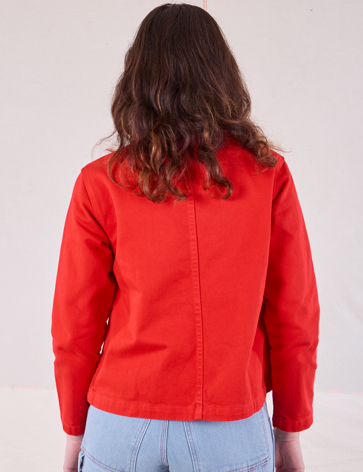 Denim Work Jacket in Mustang Red back view on Alex