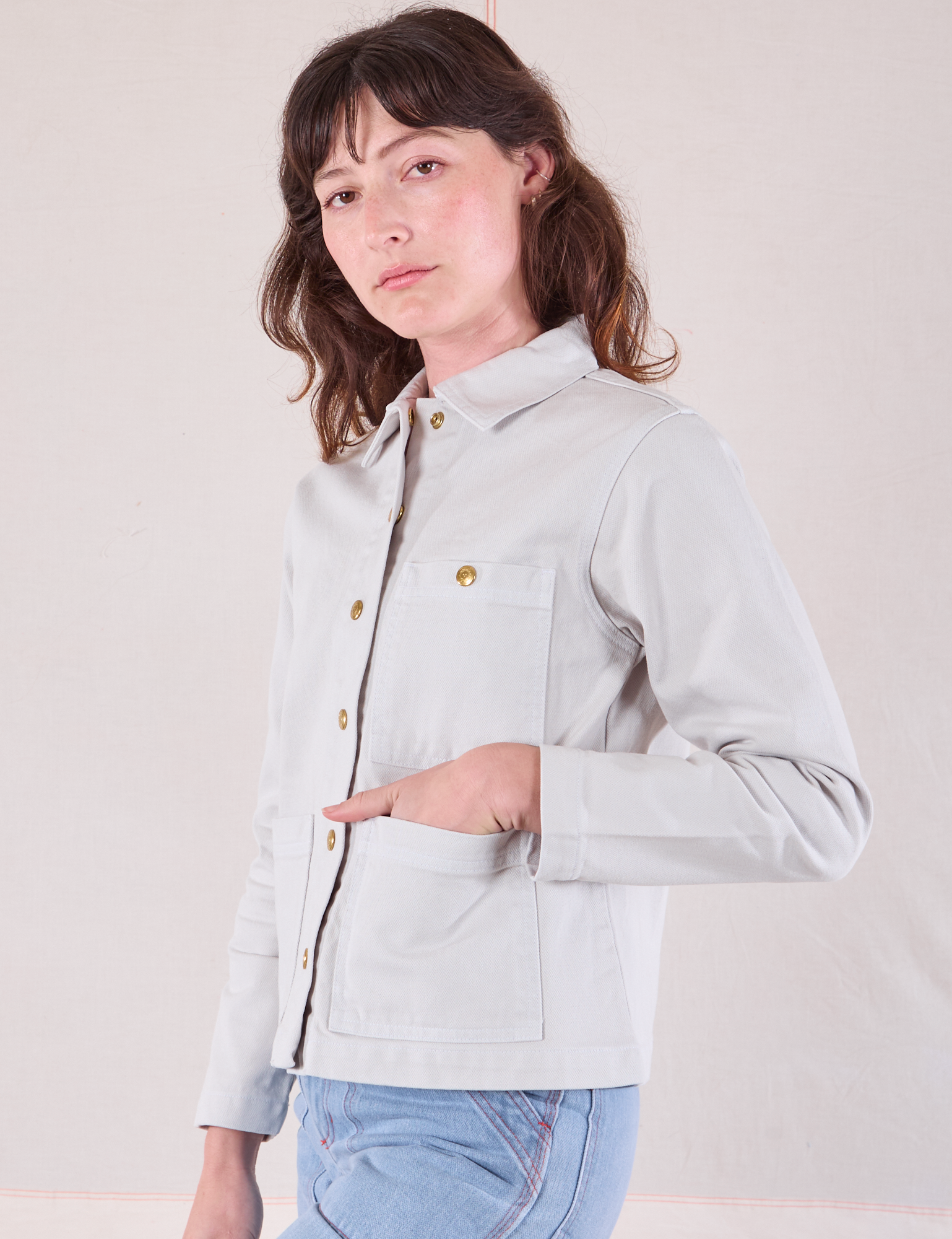 Denim Work Jacket in Stone White angled front view on Alex