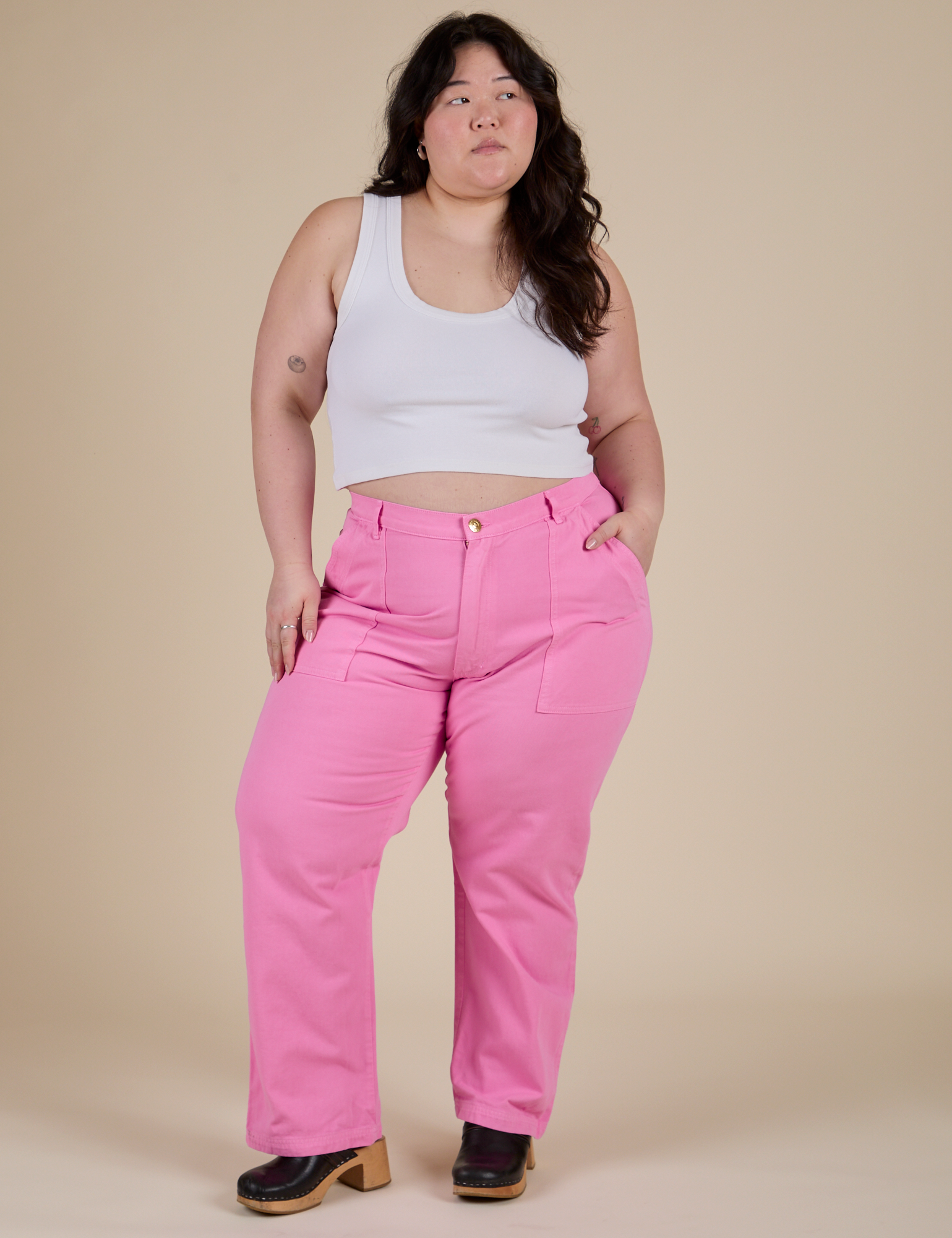 Ashley is 5’7” and wearing 1XL Work Pants in Bubblegum Pink paired with Cropped Tank in Vintage Tee White