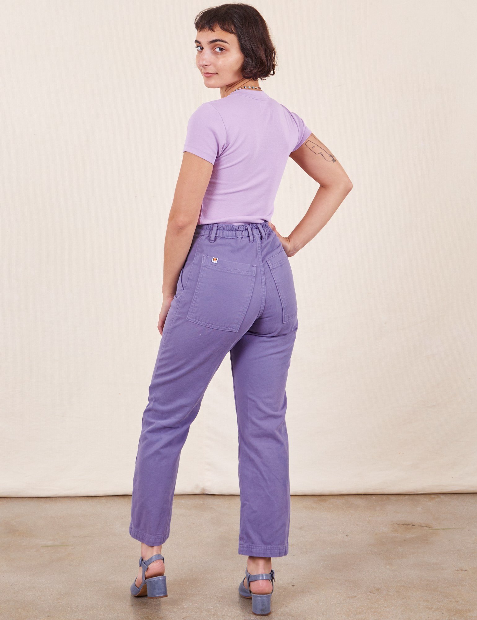 Work Pants in Faded Grape back view on Soraya wearing lilac purple Baby Tee