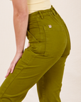 Side close up of Work Pants in Olive Green worn by Soraya