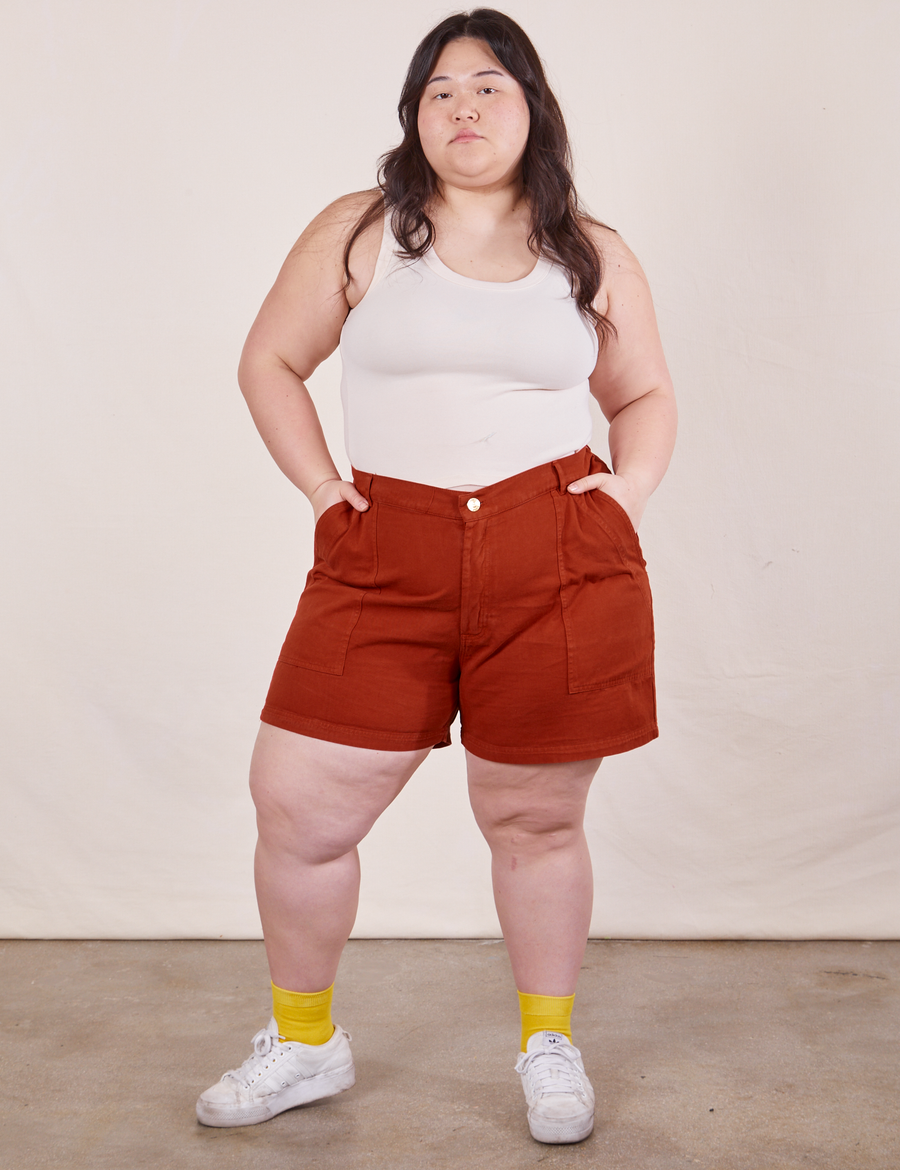 Ashley is 5'7" and wearing 1XL Classic Work Shorts in Paprika paired with vintage off-white Tank Top