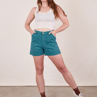 Allison is 5'10" and wearing size S Classic Work Shorts in Marine Blue paired with vintage off-white Tank Top