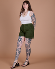 Angled front view of Classic Work Shorts in Evergreen and Cropped Tank in Vintage Tee White on Sydney