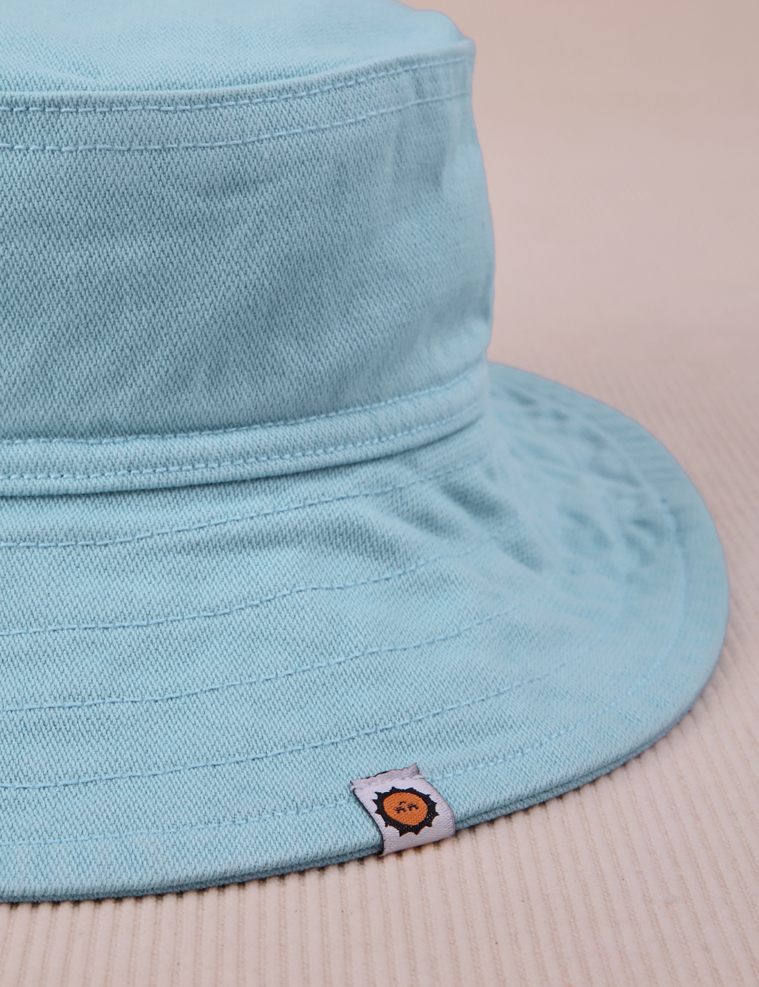 Wide Brim Denim Bucket Hat in Baby Blue close up