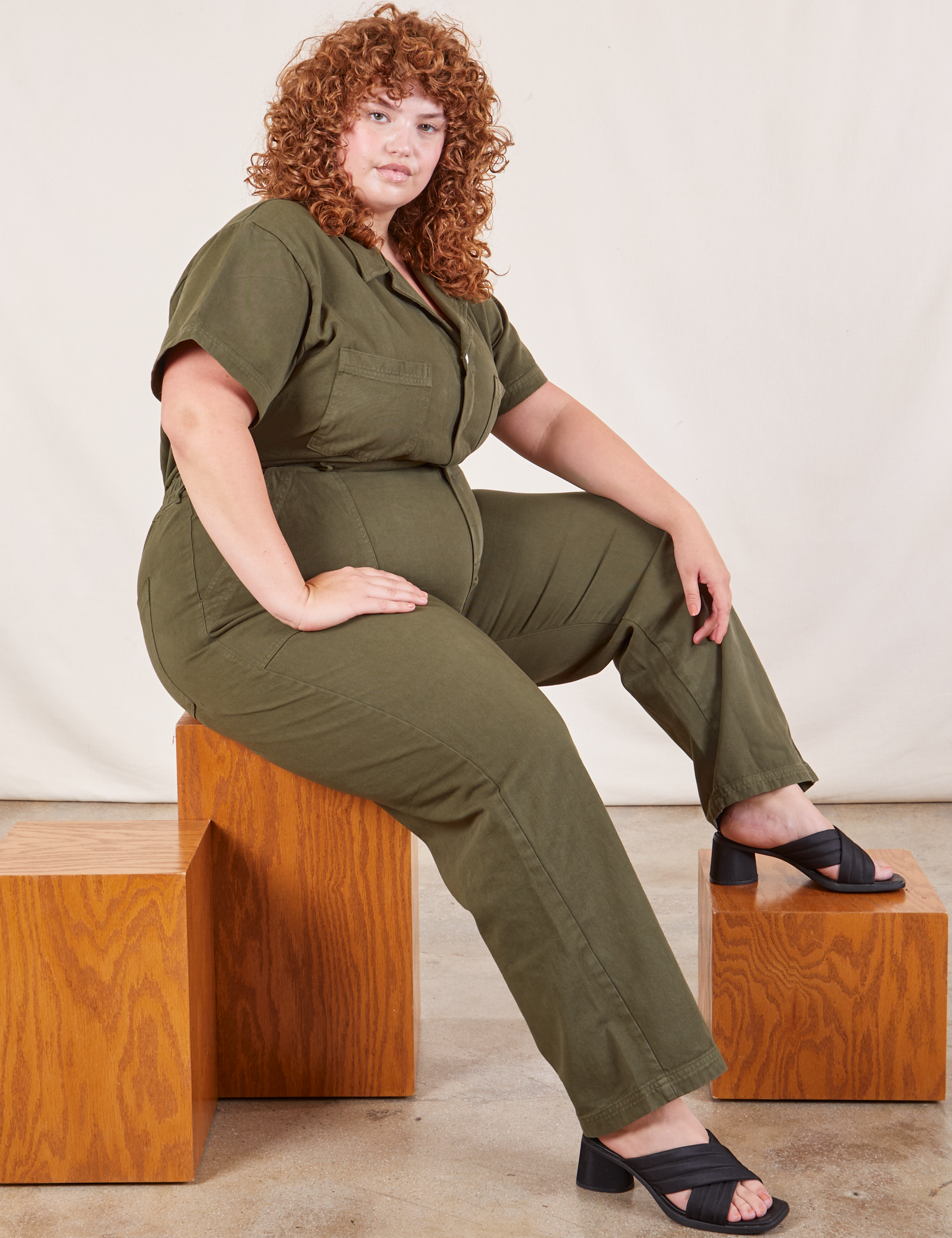 Bree is wearing Short Sleeve Jumpsuit in Surplus Green