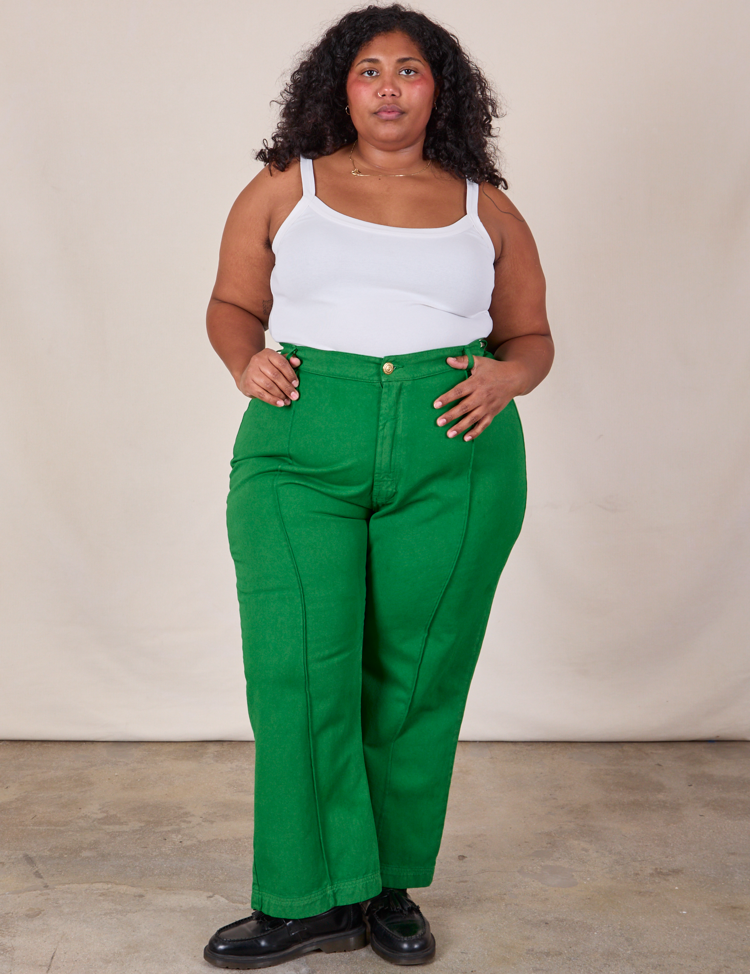 Morgan is 5&#39;5&quot; and wearing 2XL Western Pants in Forest Green paired with a Cropped Cami in Vintage Tee Off-White