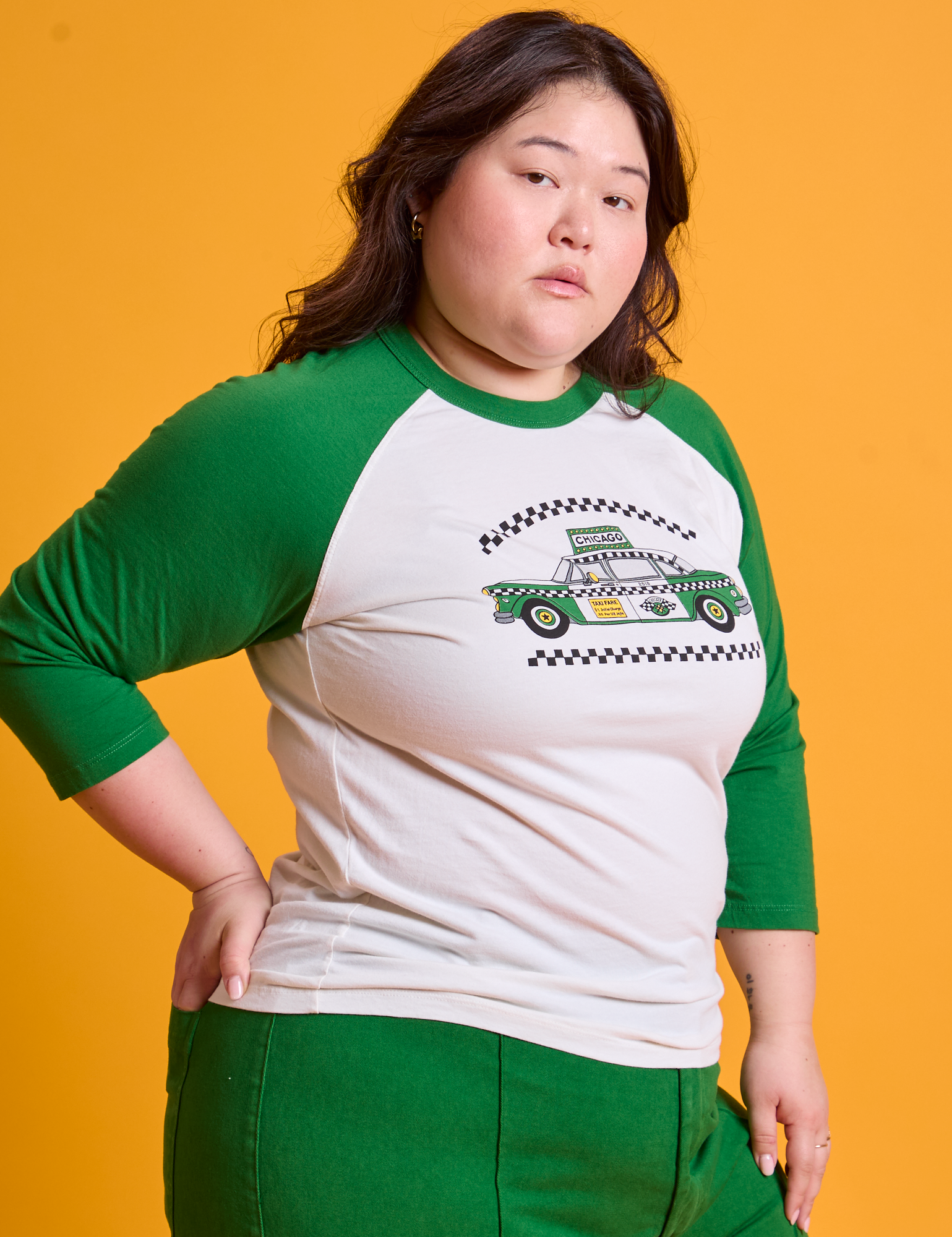 Taxi Raglan Tee in Chicago angled front view on Ashley