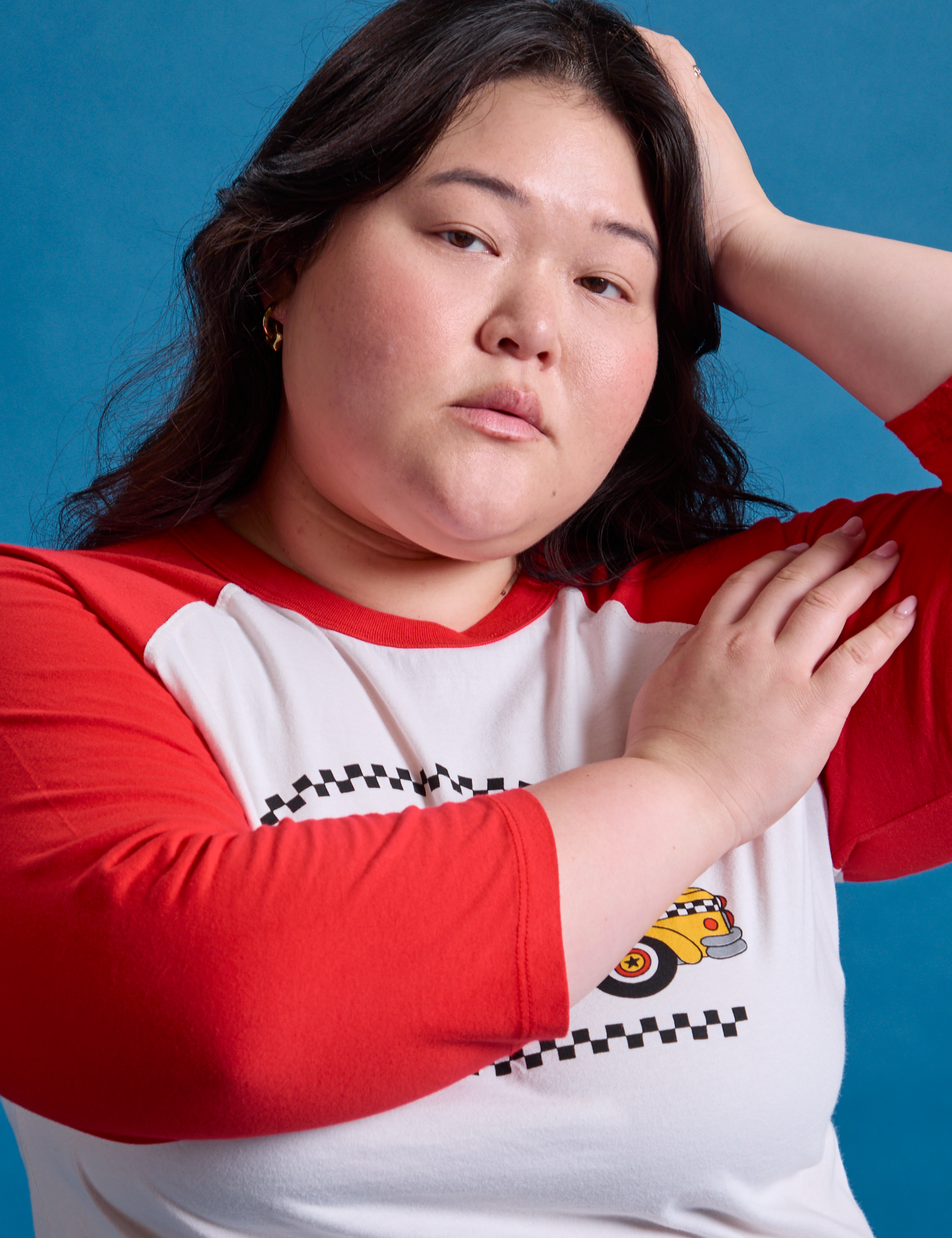 Taxi Raglan Tee in NYC with red sleeves on Ashley