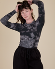 Long Sleeve Baby Tee in Black Magic Waters worn by Alex
