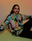Anthony is wearing Magic Waters Long Sleeve Burly Tee in Rainbow