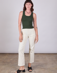 Alex is wearing Tank Top in Swamp Green and vintage tee off-white Work Pants