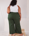 Back view of Action Pants in Swamp Green and Cropped Tank in vintage tee off-white on Morgan