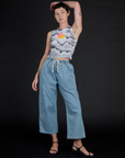 Alex wearing the Dark Cloud Airbrush Muscle Tee with Light Wash Denim Drop Pocket Pants