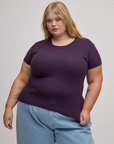 Juliet is 5'7" and wearing L Baby Tee in Nebula Purple