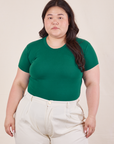 Ashley is wearing Baby Tee in Hunter Green tucked into vintage off-white Heavy Weight Trousers