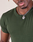 Baby Tee in Swamp Green neckline close up on Isaac