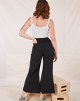 Back view of Bell Bottoms in Basic Black and vintage off-white Cami on Alex