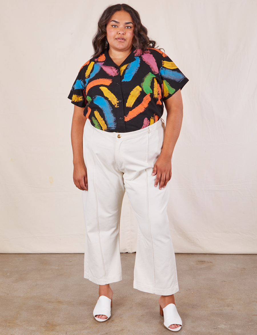 Alicia is wearing Pantry Button Up in Paint Stroke tucked into vintage off-white Western Pants.