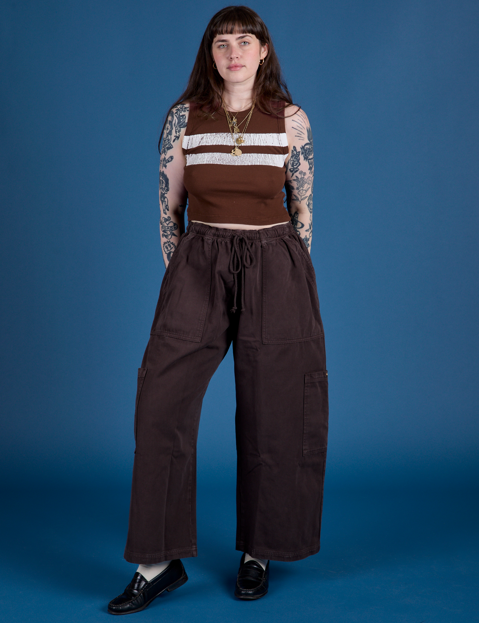 Sydney is wearing Painted Muscle Tee in Fudgesicle Brown and espresso brown Drop Pocket Cargo Pants