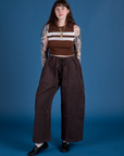 Sydney is wearing Painted Muscle Tee in Fudgesicle Brown and espresso brown Drop Pocket Cargo Pants