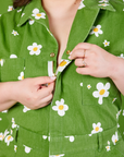 Bob Baker Flower Jumpsuit front close up. Ashley is pulling the zipper tab down.