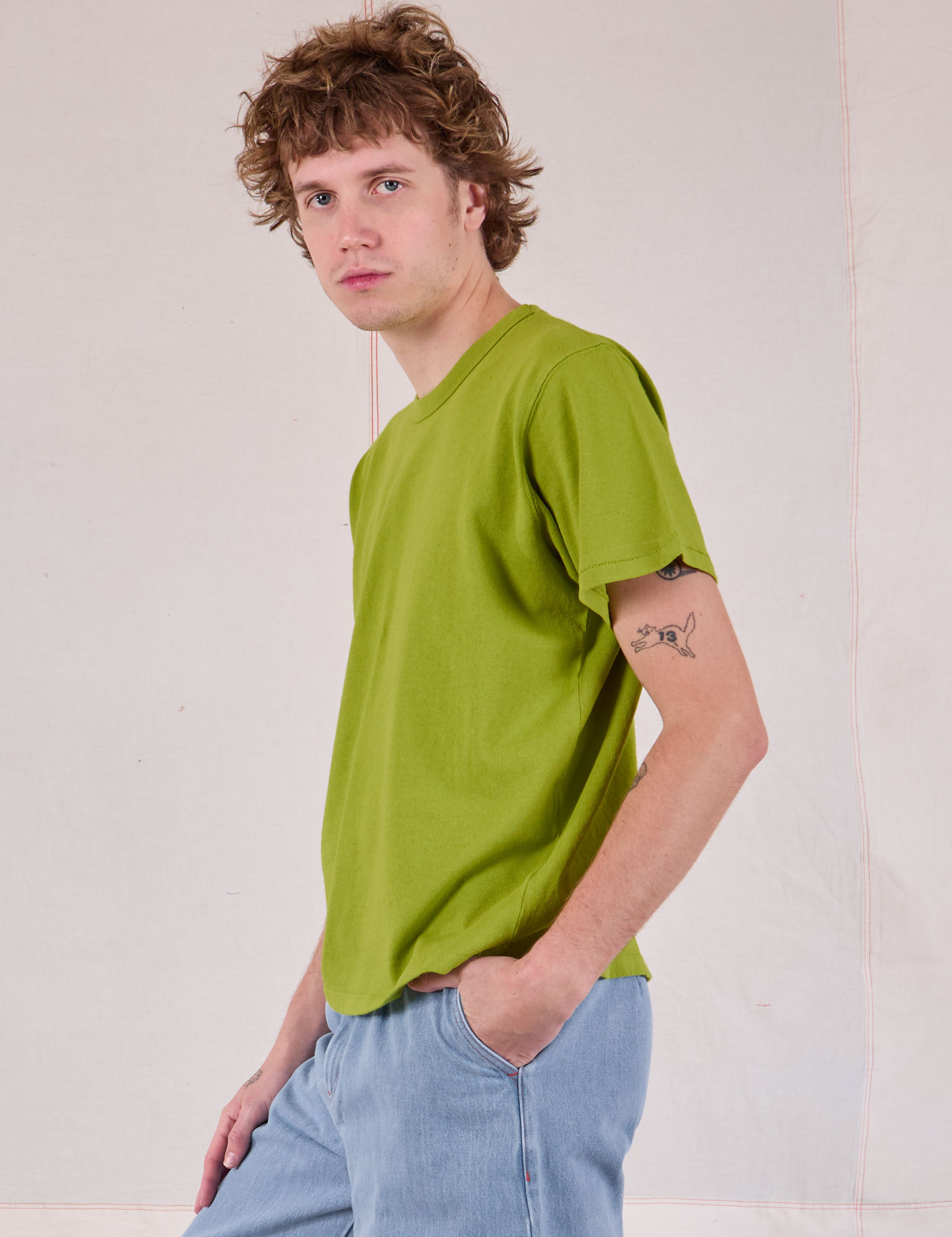 Burly Tee in Gross Green side view on Quinn