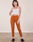Alex is wearing Pencil Pants in Burnt Terracotta and vintage off-white Cropped Cami