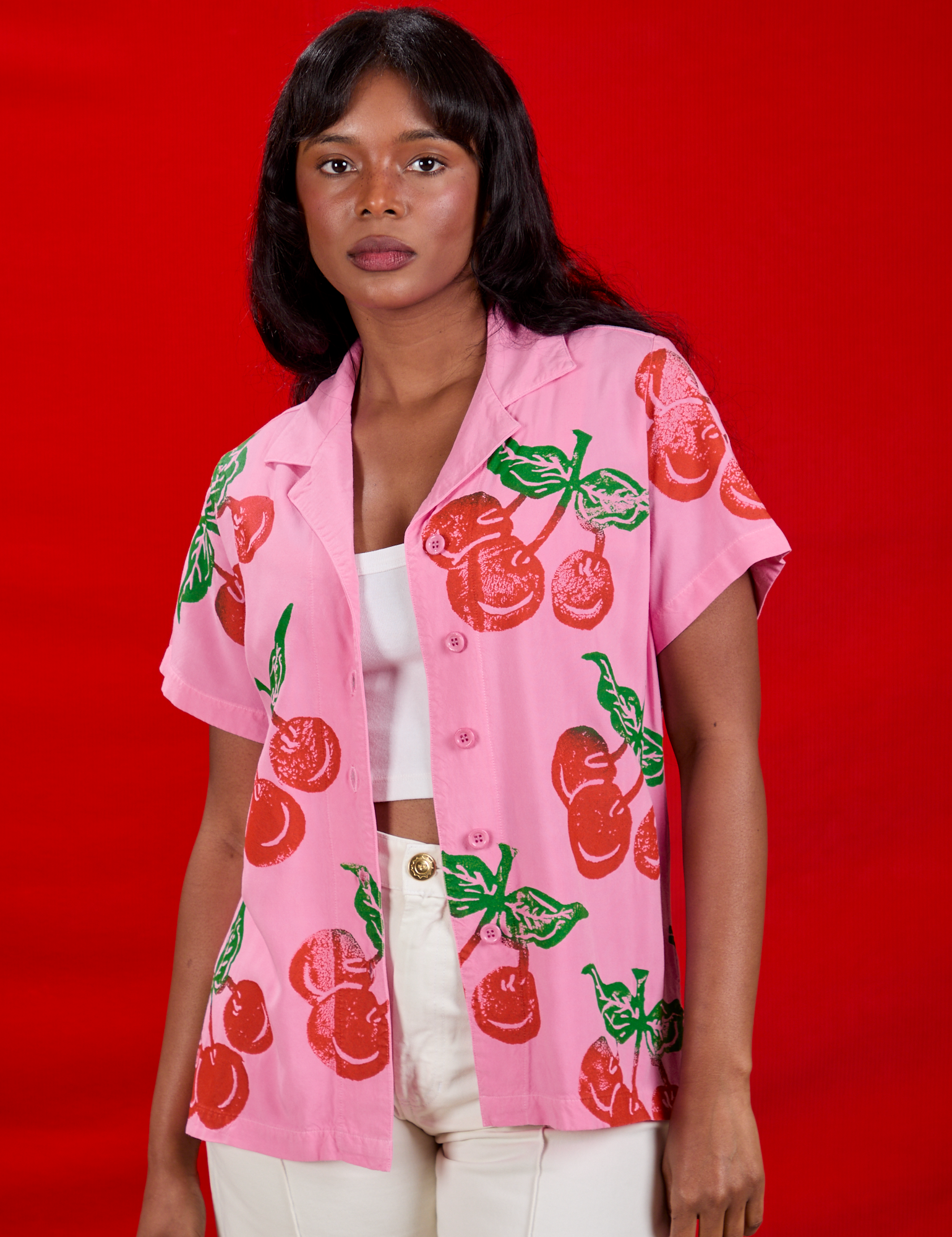Kandia is 5&#39;3&quot; and wearing XXS Cherry Pantry Button-Up