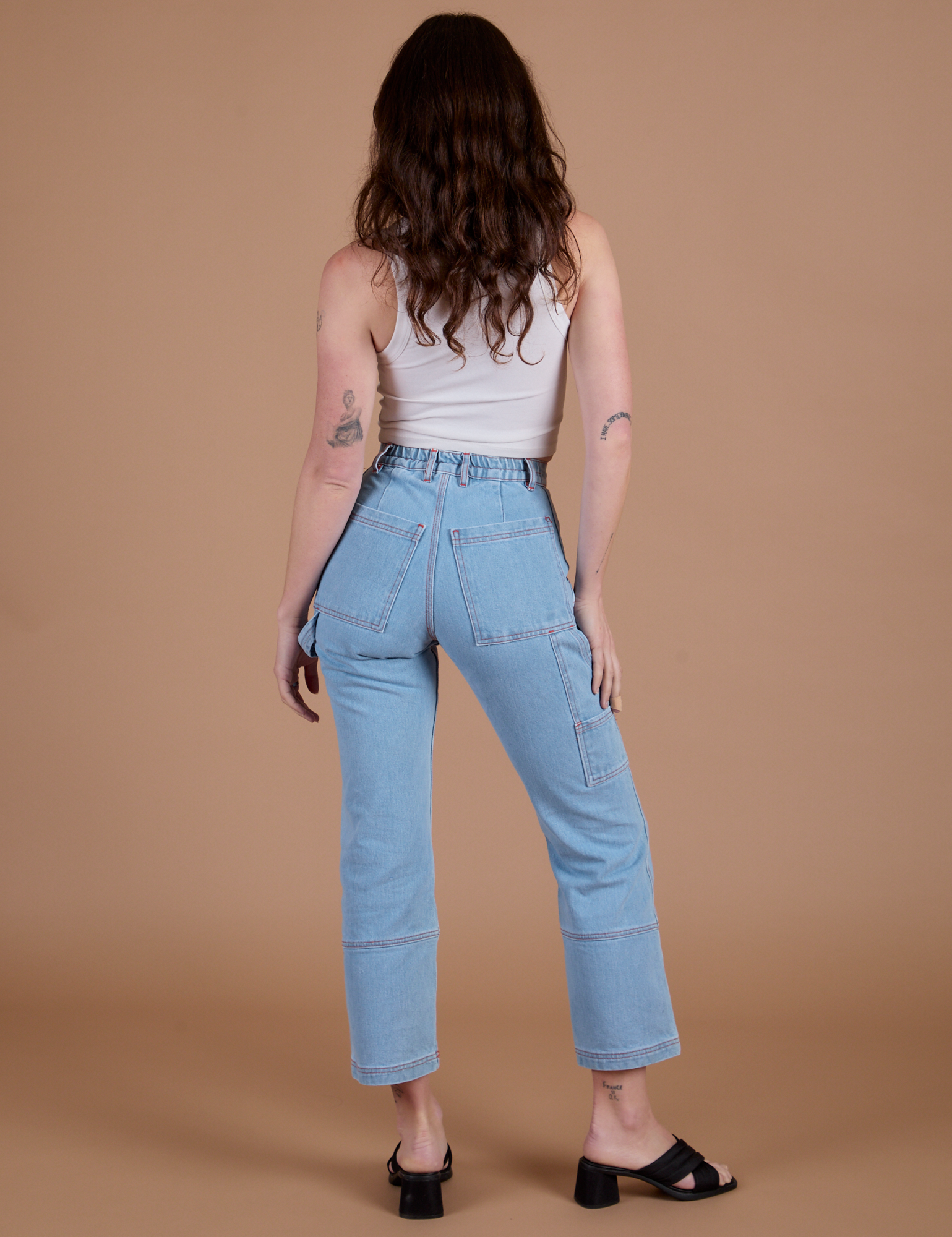 Carpenter Jeans in Light Wash back view on Alex