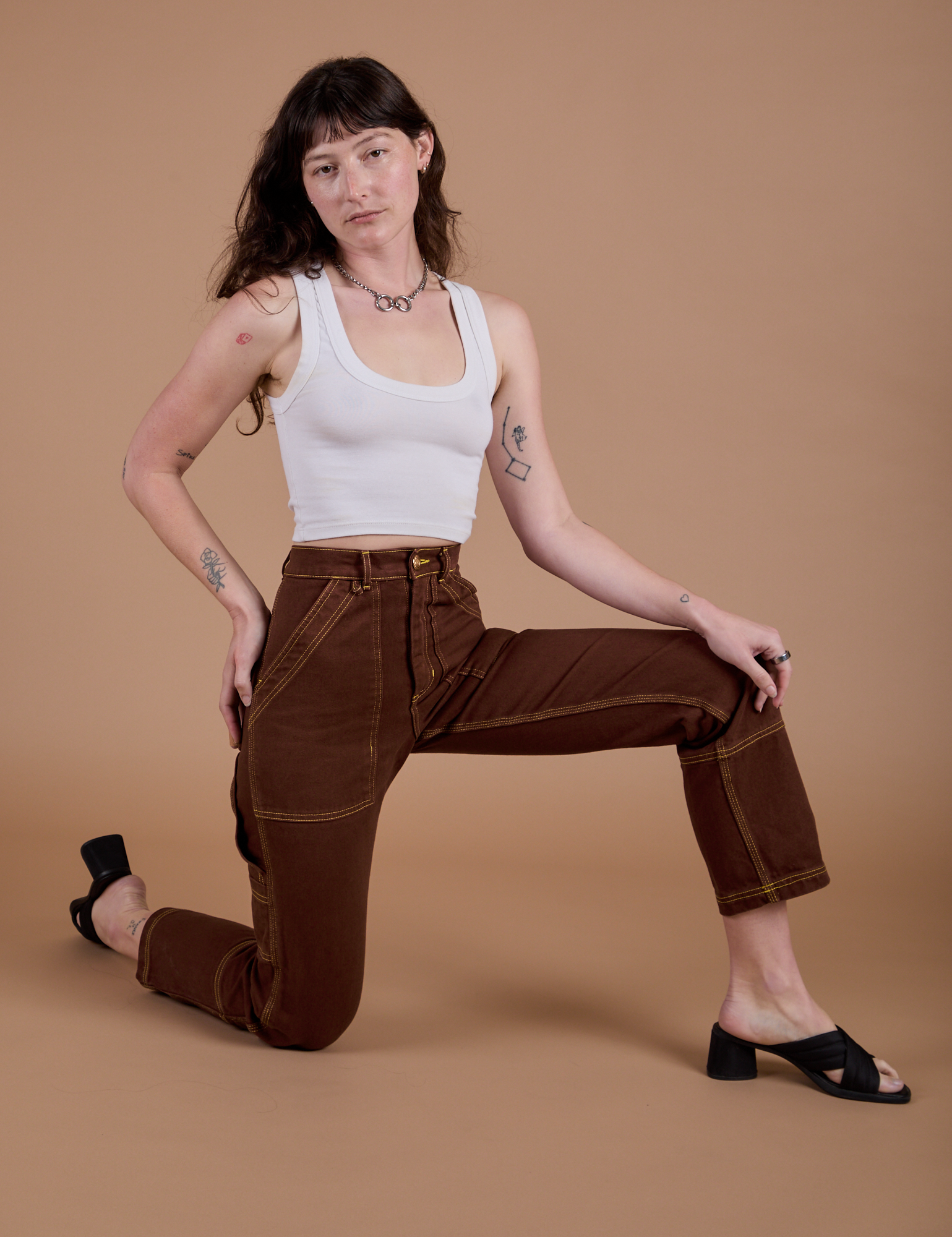 Carpenter Jeans in Fudgesicle Brown and Cropped Tank in Vintage Tee White on Alex