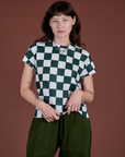 Alex is 5'8" and wearing P Checker Organic Tee in Swamp Green