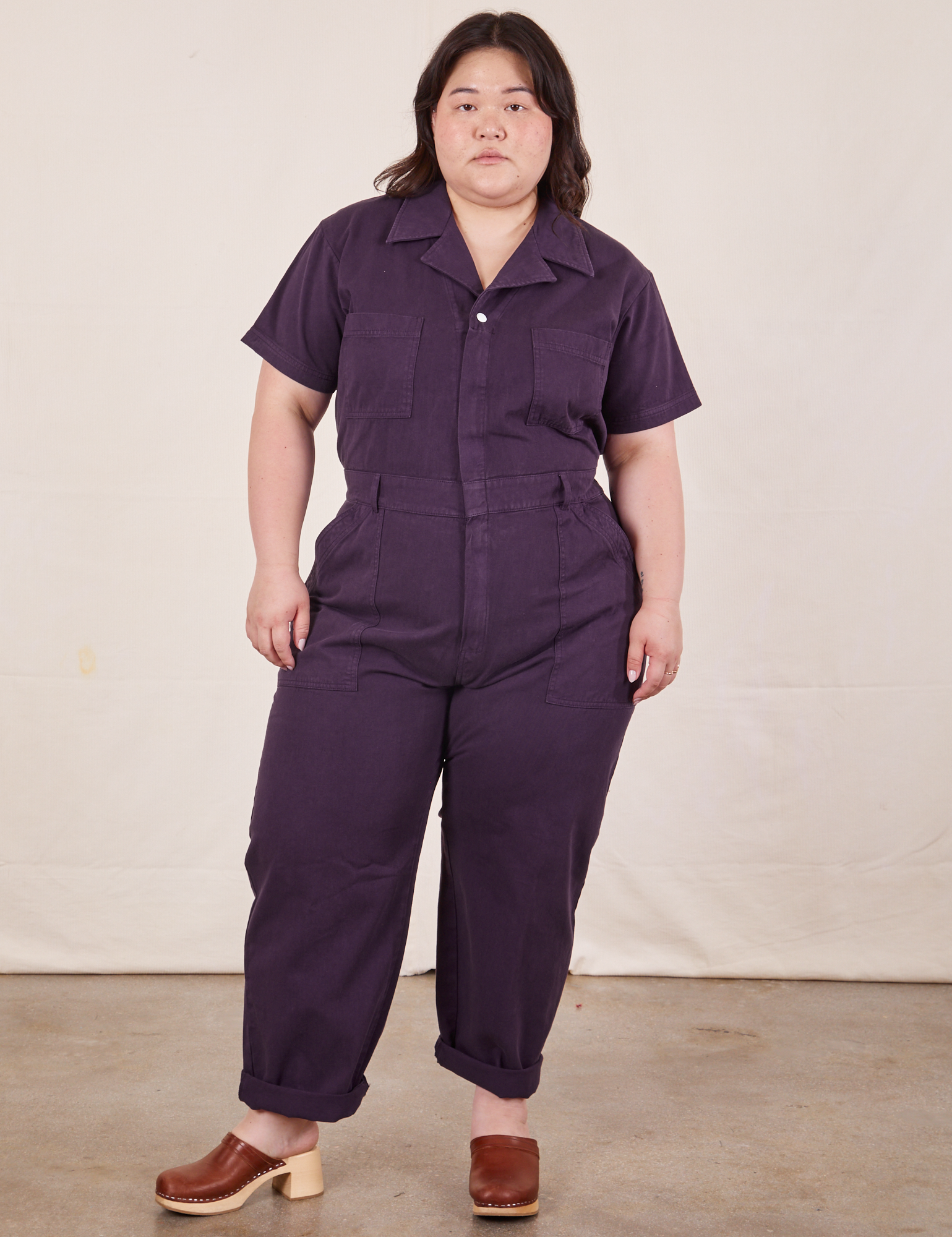 Ashley is 5&#39;7&quot; and wearing 1XL Short Sleeve Jumpsuit in Nebula Purple