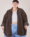 Jordan is 5'4" and wearing 4XL Corduroy Overshirt in Espresso Brown with a vintage off-white Cropped Tank Top underneath paired with light wash Denim Trouser Jeans