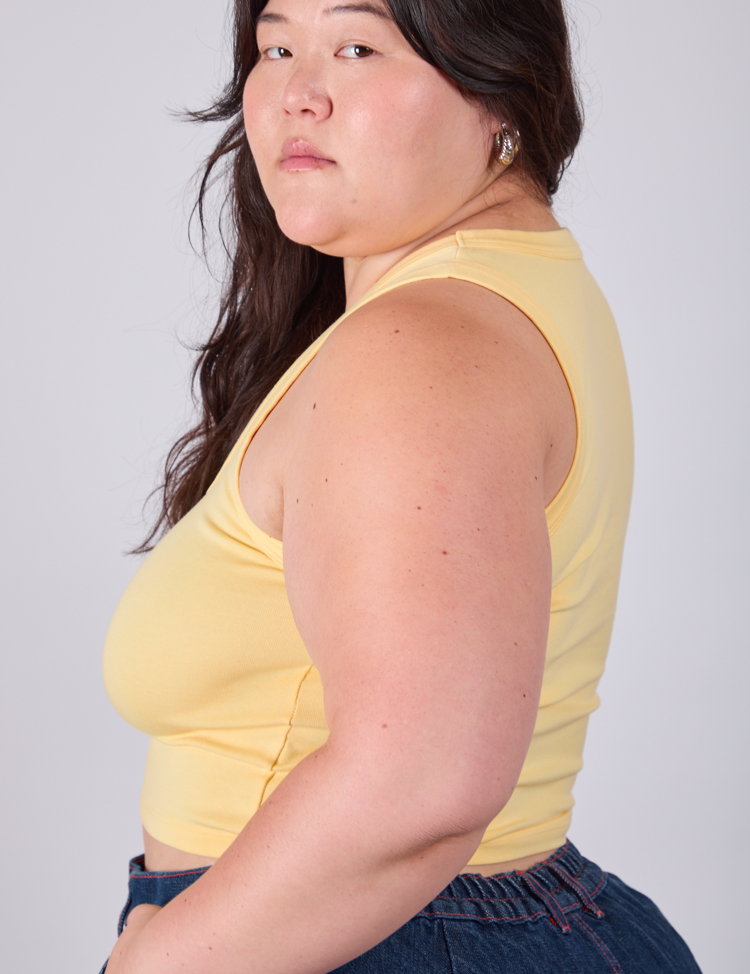 Side view of Cropped Tank Top in Butter Yellow on Ashley