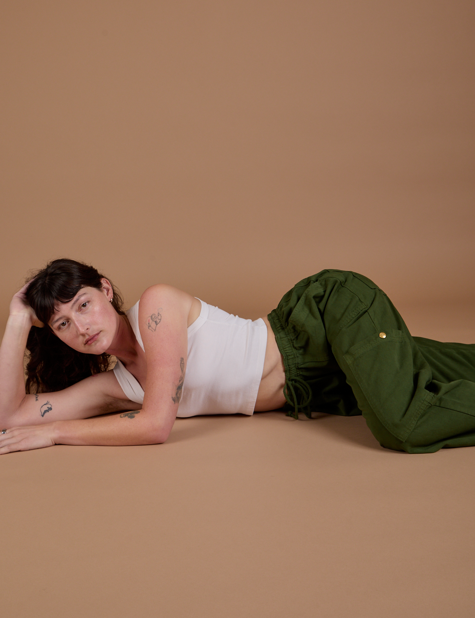 Drop Pocket Cargo Pants in Evergreen and Cropped Tank in vintage tee white worn by Alex