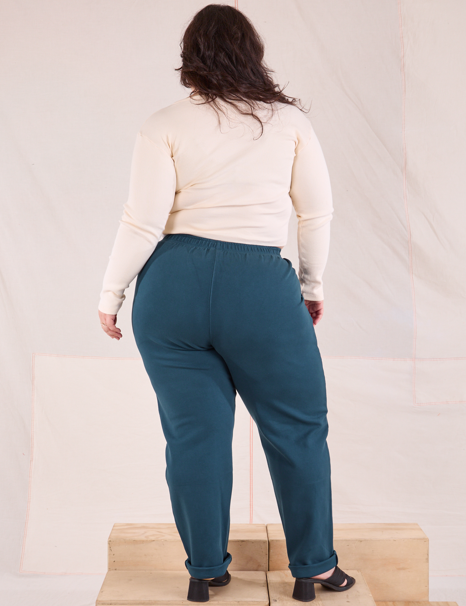 Back view of Easy Pants in Lagoon and vintage tee off-white Long Sleeve V-Neck Tee on Ashley