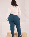 Back view of Easy Pants in Lagoon and vintage tee off-white Long Sleeve V-Neck Tee on Ashley