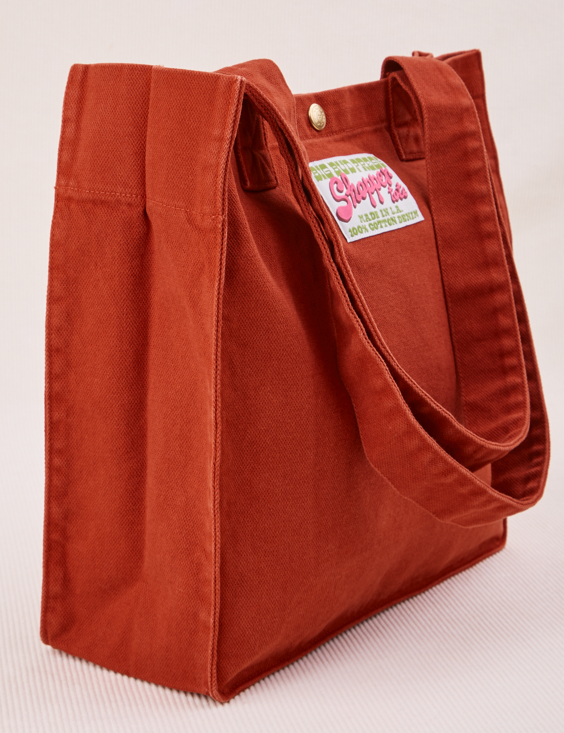 Angled view of Shopper Tote Bag in Paprika