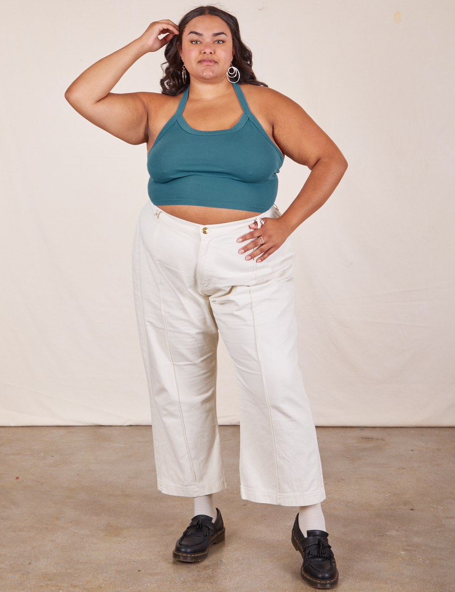 Alicia is wearing Halter Top in Marine Blue and vintage off-white Western Pants
