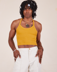 Jerrod is wearing Halter Top in Mustard Yellow and vintage off-white Western Pants