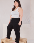 Angled front view of Rolled Cuff Sweat Pants in Basic Black and vintage off-white Cropped Tank on Ashley