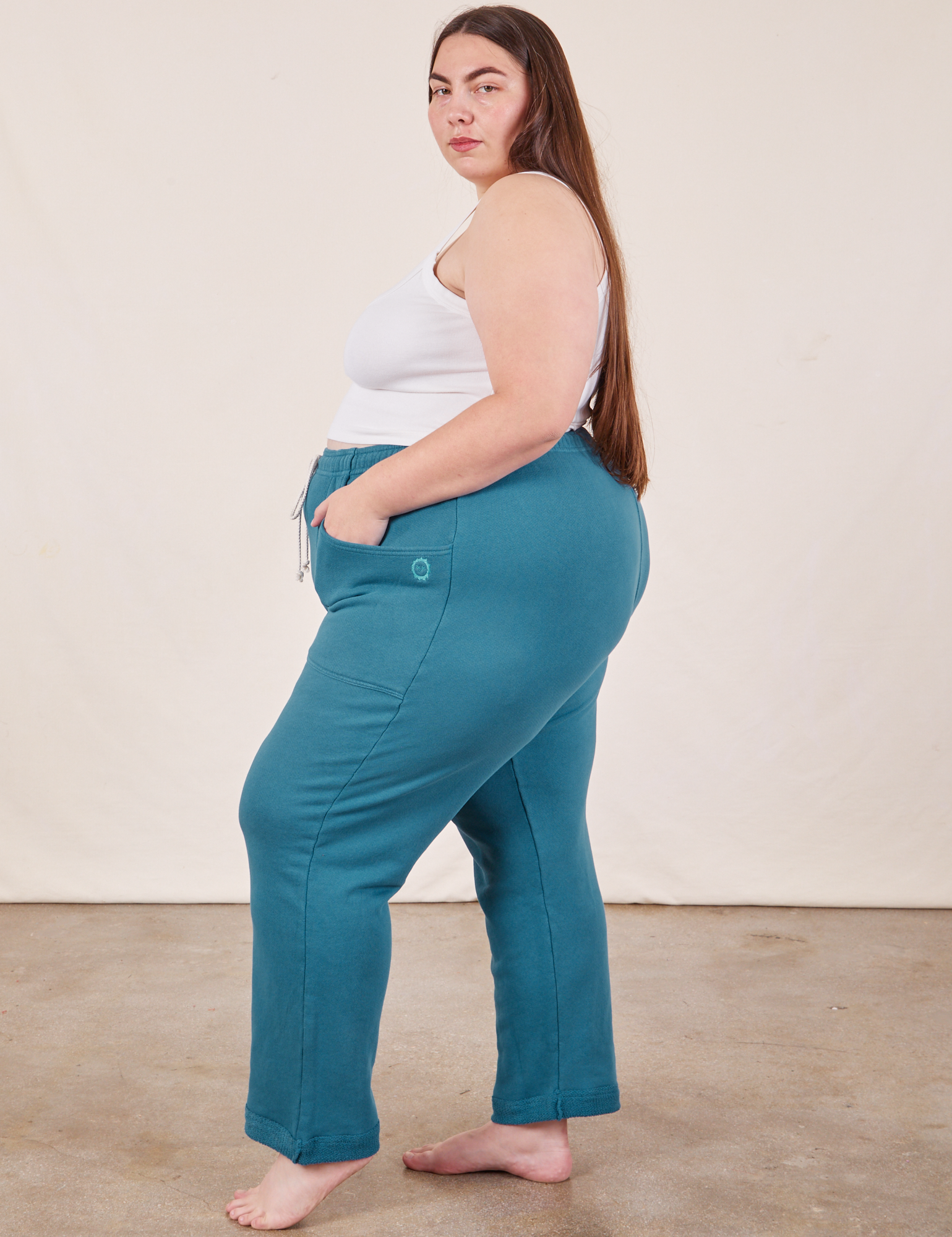 Side view of Cropped Rolled Cuff Sweatpants in Marine Blue on Marielena